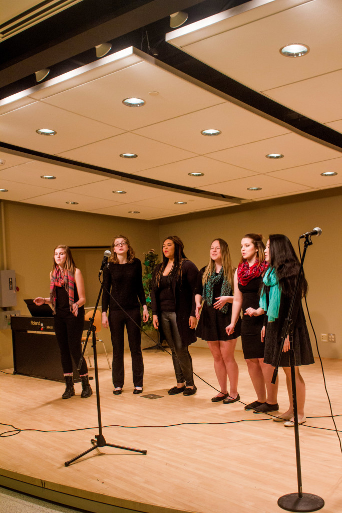 Members of Vocal Point perform at Tim Hortons (left to right; Rachel Schank, Brittany Sandord, Tala Harden, Liana Kaplan, Brook Mellon, Miki Toda) Photo by Corey Maher