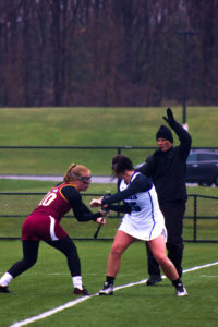 #25 Audrey Yokopovich prepares to face off against St. John FisherPhoto by Corey Maher