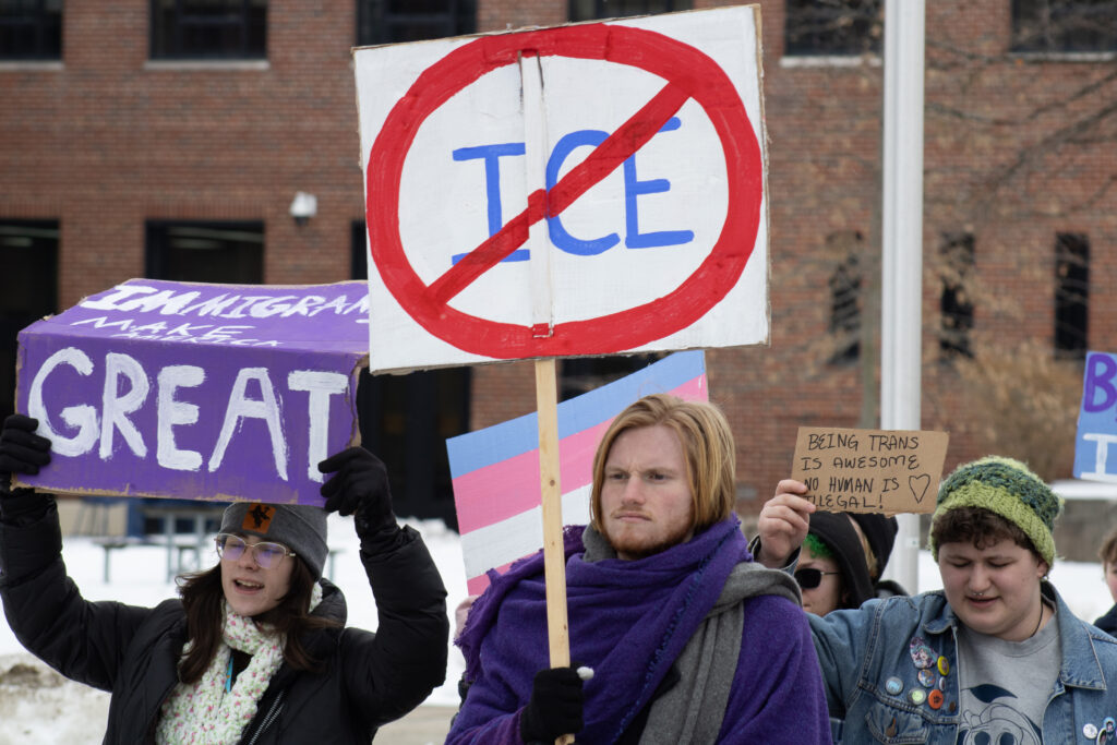 Bob Evans and others protest in support of immigrants and the LGBTQ+ community